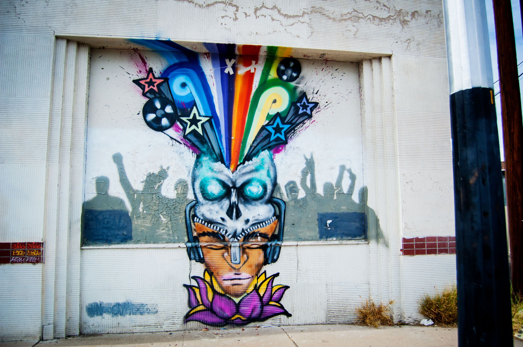 Skeleton wearing a man mask mural